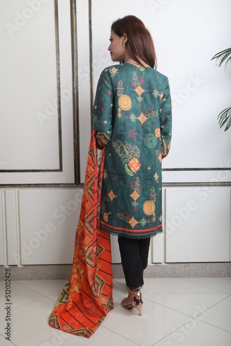 A Pakistani  Model showing her dress with style, 

A Pakistani Model Wearing Eastern Dress photo