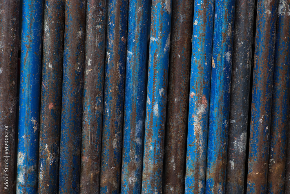 rust metal vertical lines background blue tubes scaffold industrial iron texture rust metal vertical lines background blue tubes scaffold industrial iron texture