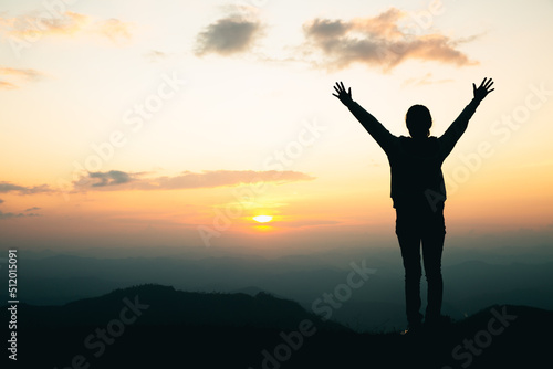 silhouette of a woman praying on the mountain, Praying hands with faith in religion and belief in God.