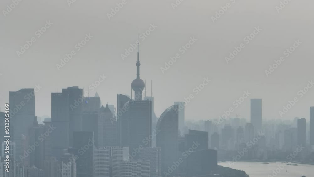 Drone aerial view of City skyline in the heavy fog in cloudy day. Long distance shot of skyline in Lujiazui downtown district in Shanghai China. Business, travel and economy concept b-roll footage. Drone aerial view of City skyline in the heavy fog in cloudy day. Long distance shot of skyline in Lujiazui downtown district in Shanghai China. Business, travel and economy concept b-roll footage.