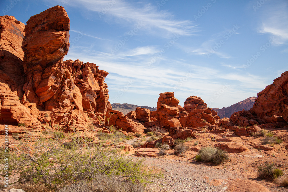 Fototapeta premium Red sandstone eroded with a road winding through the national park in America