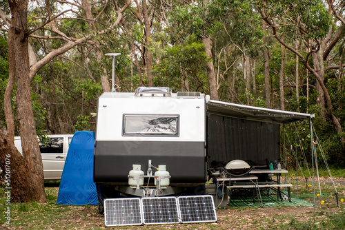 Obraz na plátně RV caravan camper on a campsite in the bush forest nature