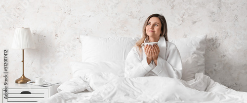 Pretty young woman drinking...