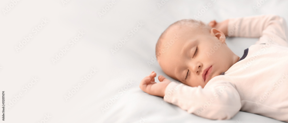Cute little boy sleeping in bed with space for text Cute little boy sleeping in bed with space for text