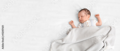 Cute little baby lying on b...