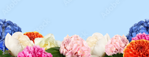 Fototapeta Naklejka Na Ścianę i Meble -  Beautiful different flowers on light blue background with space for text. Banner for design
