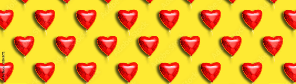 Beautiful heart-shaped balloon for Valentine's Day celebration on yellow background