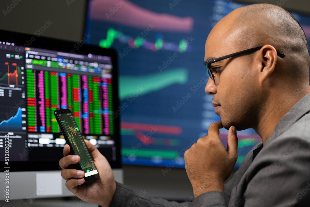 Investor businessman analyzing a graphic of a stock cryptocurrency exchange chart and looks at computer monitor. Financial analyst working with real-time exchange rate diagram. Investment concept Investor businessman analyzing a graphic of a stock cryptocurrency exchange chart and looks at computer monitor. Financial analyst working with real-time exchange rate diagram. Investment concept