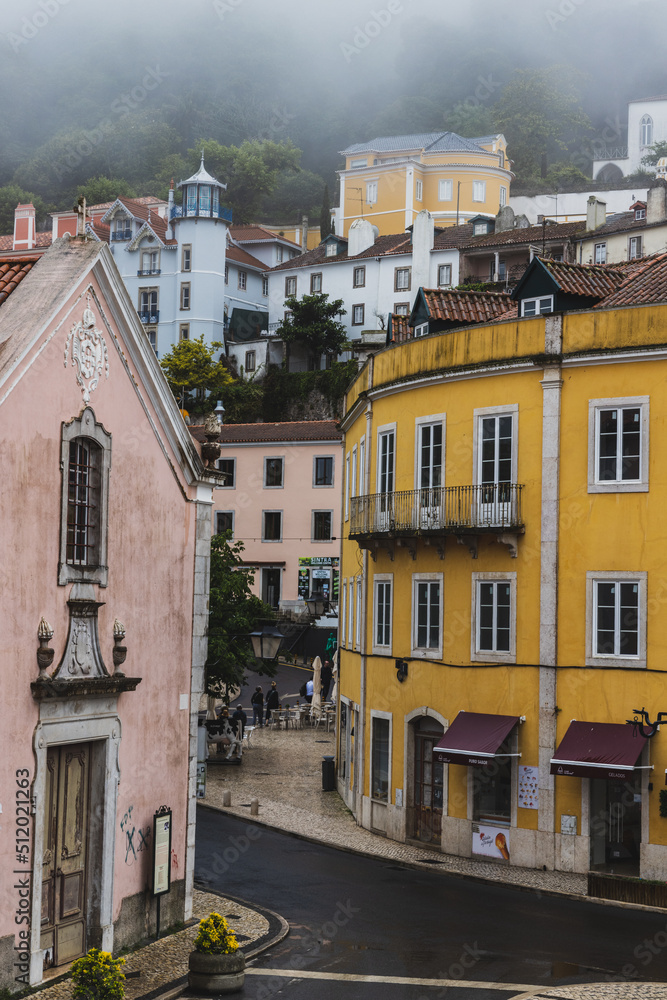 A colorful European town in Sintra, Portugal on a foggy morning