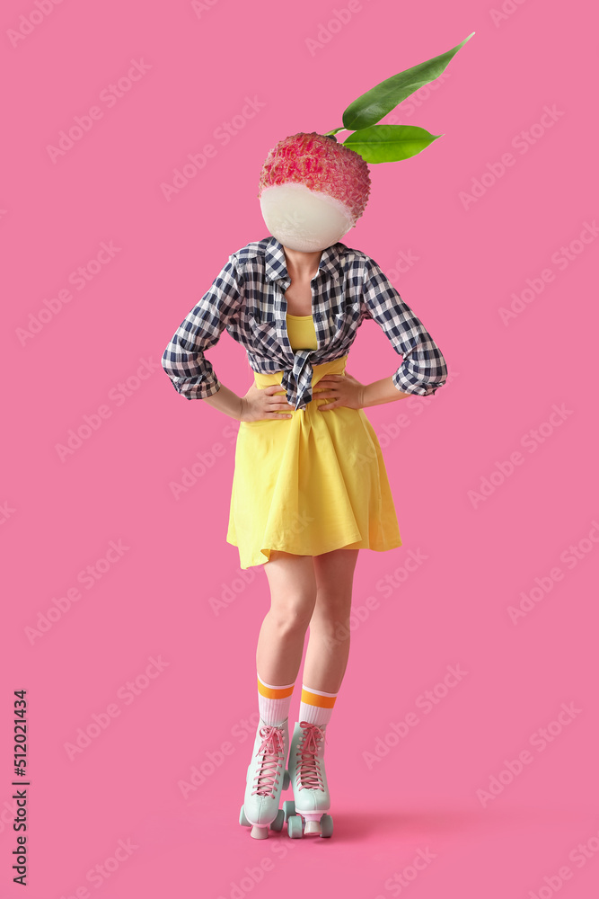 Woman with ripe litchi fruit instead of her head and on roller skates against pink background
