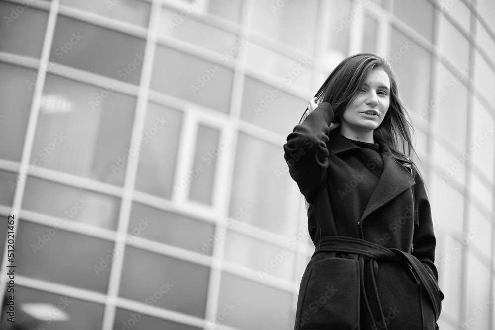 Fototapeta premium Girl in a coat black and white photo