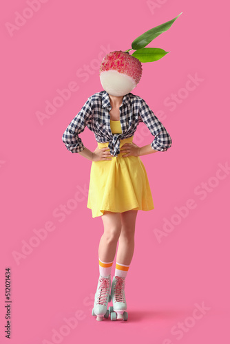 Woman with ripe litchi frui...