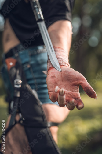 sharp knife in female hand at outdoor