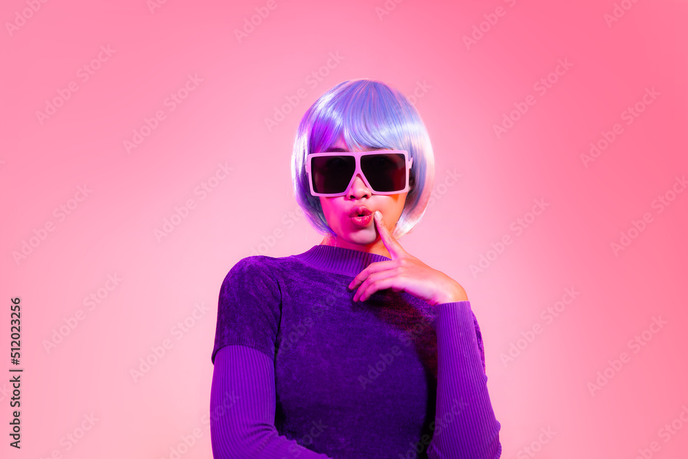 Cyber punk girl concept, asian woman in purple sweatshirt silver and blue short hair style wearing sunglasses posing like robot. Cyber punk girl concept, asian woman in purple sweatshirt silver and blue short hair style wearing sunglasses posing like robot.
