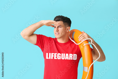 Beach rescuer with lifebuoy...