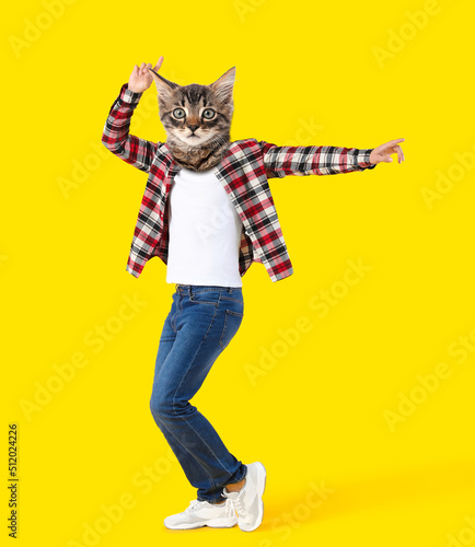 Dancing kitten with human body on yellow background