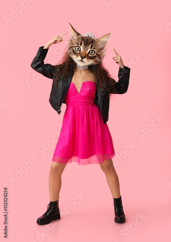 Fashionable kitten with human body on pink background