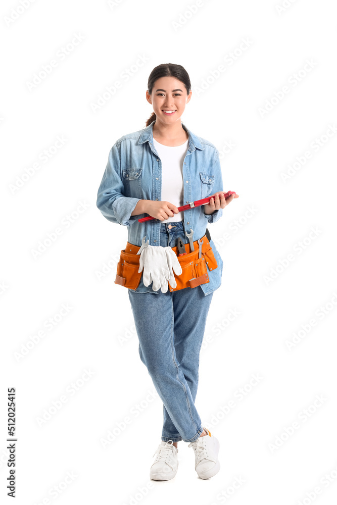Asian female plumber with tool on white background Asian female plumber with tool on white background