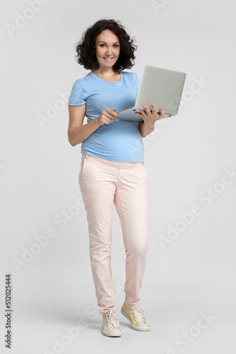 Young pregnant woman using ...