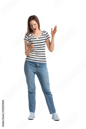 Angry young woman with mobi...