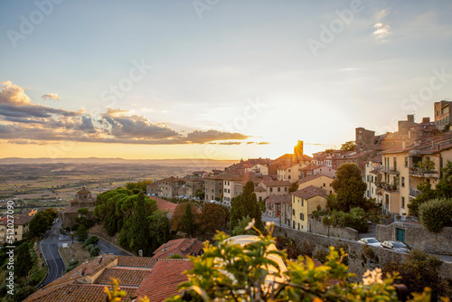 Italy, Province of Arezzo, Cortona, View of town overlooking Chiana Valley at sunset photo