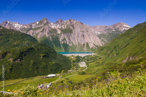 Summer landscape of Morasco lake and Riale alpine village in Val Formazza, Piedmont, Italy