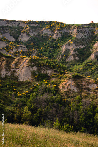 Eroded hills in Montespino, near Pesaro and Urbino in Italy, at evening before the sunset