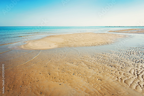 Fototapeta Naklejka Na Ścianę i Meble -  View of the Adriatic Sea from the sandy beach in Pesaro, Italy, during a sunny spring day
