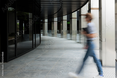 Wallpaper Mural Blurred motion of woman entering in building Torontodigital.ca