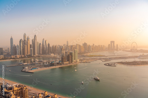 United Arab Emirates, Dubai, View of coastal city at sunset