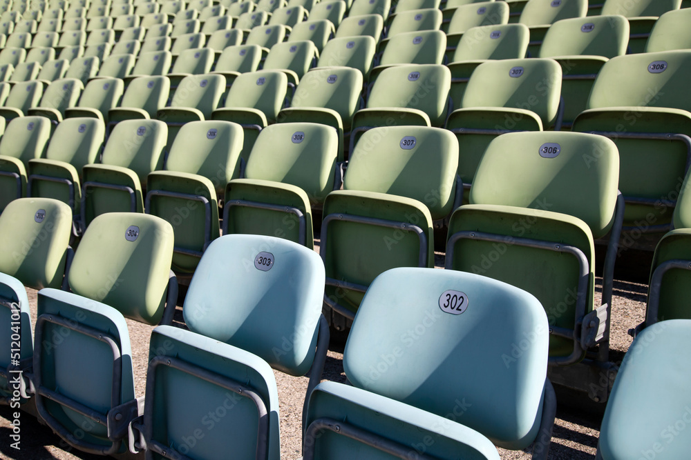 Empty Plastic Chairs at the Stadium Empty Plastic Chairs at the Stadium