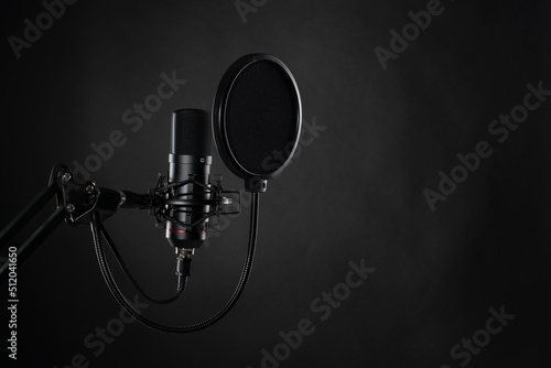 Proffesional studio microphone, isolated on the black background.