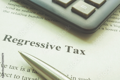 Konstfotografi Regressive tax page, a calculator and pen.