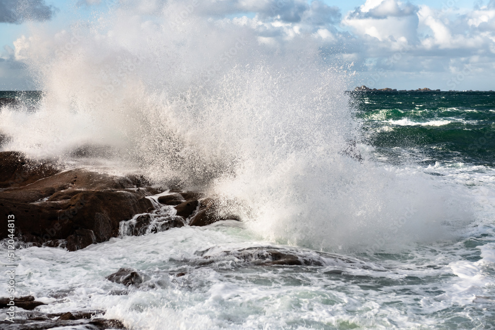 Rough sea and big waves hit rocks creating enormous spray. Rough sea and big waves hit rocks creating enormous spray.