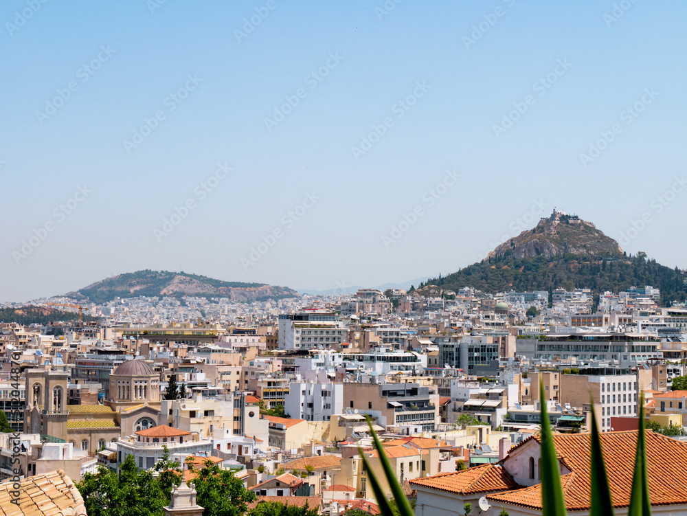 Panorama of Athens, Greece on a hot summer day with views on Lycabettus Hill