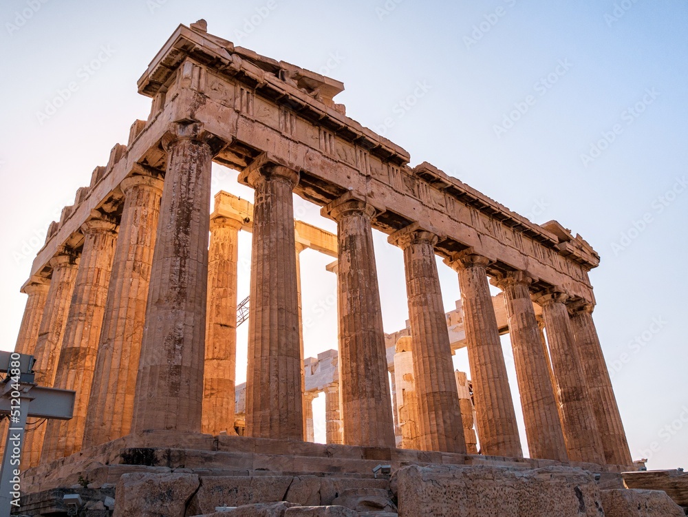 Ancient colums of the Parthenon on Acropolis Hill, Athens, Greece during sunset
