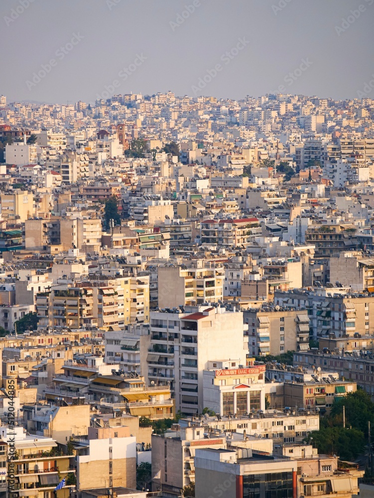 Views of Athens' dense city scape seen from Acropolis hill during sunset (vertical)