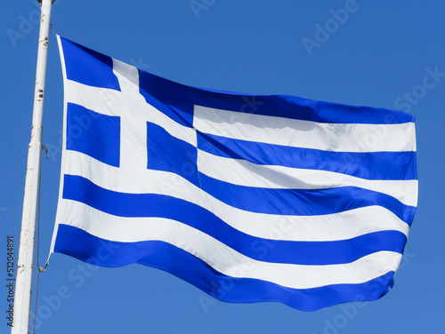 Greek Flag flying atop the Acropolis Hill in Athens, Greece