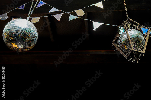 Mirror disco ball with silver decoraions. retro Club style interior photo