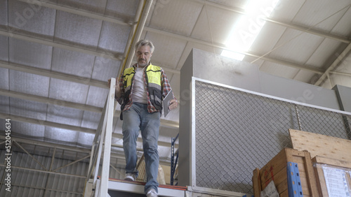 Employee is checking the goods in the warehouse.