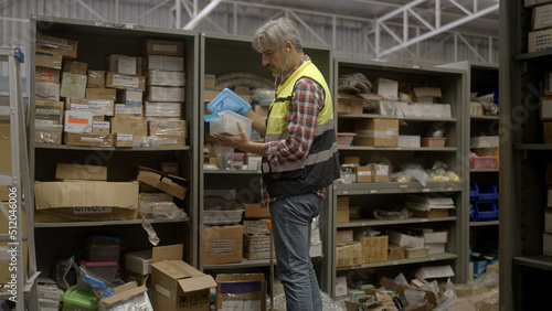 Employee is checking the goods in the warehouse.