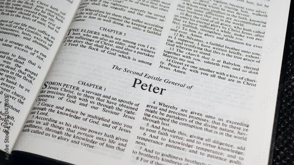 Close Up Shot of Bible Page Turning to the book of Second Peter Close Up Shot of Bible Page Turning to the book of Second Peter