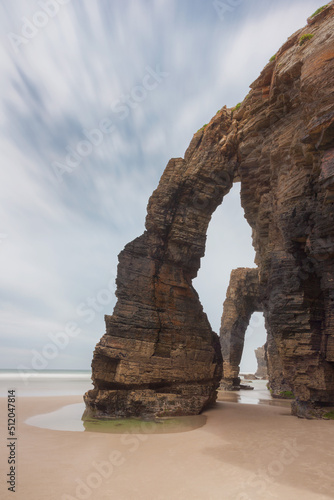Vertical view of the famous rock formations of the beach of the cathedrals, in the region of Ribadeo, Lugo, Spain photo