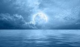 Night sky with blue moon in the clouds over the calm blue sea, many stars in the background  
