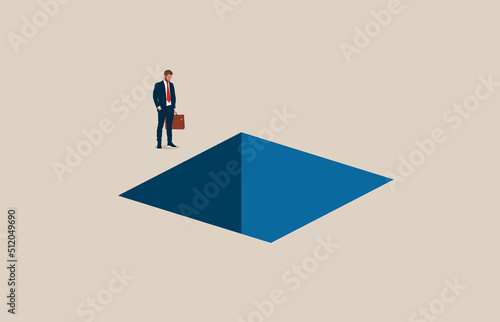 Business depression or burnout syndrome. Businessman standing next to hole in ground.