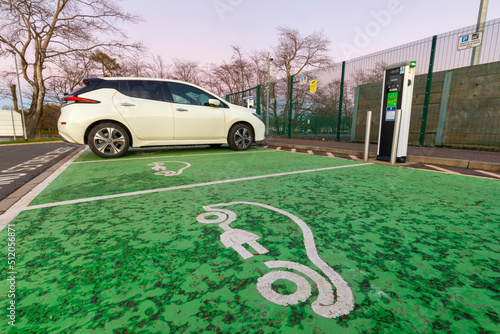 Electric car charging point and car parking space, Glasgow, Scotland