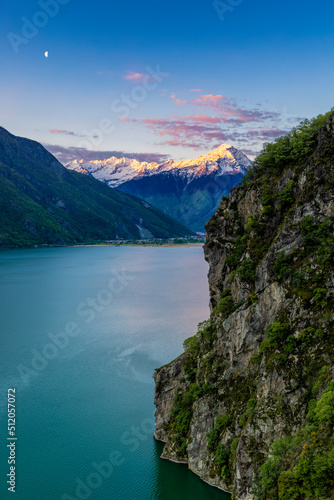 Monte Legnone at sunrise from elevated viewpoint above Lago di Novate, Valchiavenna, Valtellina, Lombardy, Italy photo