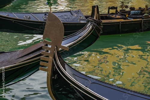 View of empty gondolas with the distinctive iron prow head, Venice, Veneto, Italy photo