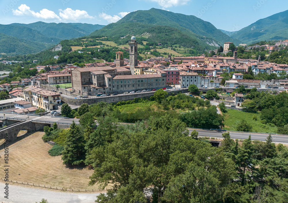 Aerial view of Bobbio, a town on the Trebbia river. Bridge. Piacenza, Emilia-Romagna. Details of the urban complex, roofs and bell towers of the town between the valleys of the Apennines. Italy
