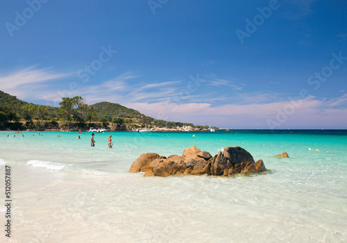 Tourists relaxing in shallow turquoise water off the Plage de Verghia, Coti-Chiavari, Ajaccio, Corse-du-Sud